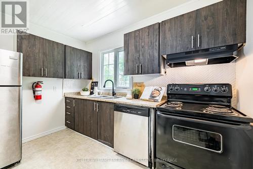 76 Metro Road N, Georgina (Historic Lakeshore Communities), ON - Indoor Photo Showing Kitchen With Double Sink