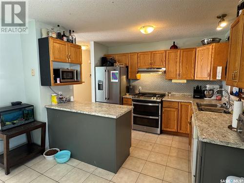 912 Aronec Place, La Ronge, SK - Indoor Photo Showing Kitchen With Stainless Steel Kitchen With Double Sink