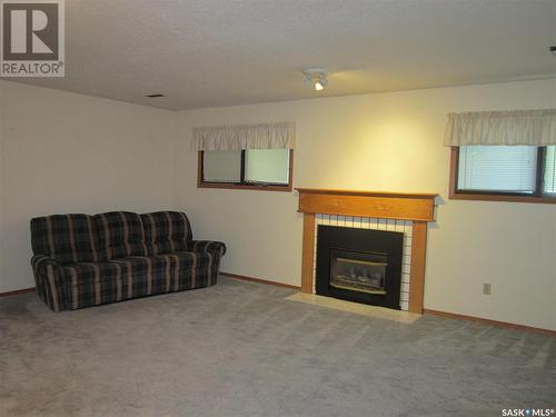 27 Groat Drive, Melfort, SK - Indoor Photo Showing Living Room With Fireplace