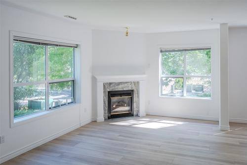 207-2245 Atkinson Street, Penticton, BC - Indoor Photo Showing Living Room With Fireplace