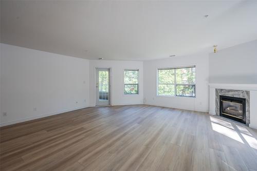 207-2245 Atkinson Street, Penticton, BC - Indoor Photo Showing Living Room With Fireplace