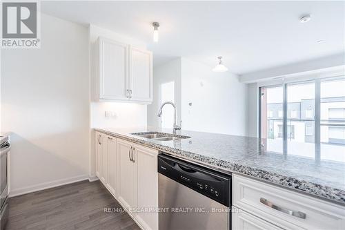 301 - 3028 Creekshore Common, Oakville, ON - Indoor Photo Showing Kitchen With Double Sink With Upgraded Kitchen