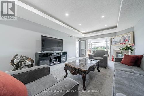 308 - 990 Golf Links Road, Hamilton (Meadowlands), ON - Indoor Photo Showing Living Room With Fireplace