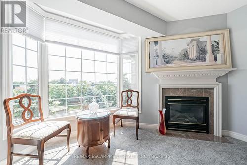 308 - 990 Golf Links Road, Hamilton (Meadowlands), ON - Indoor Photo Showing Living Room With Fireplace