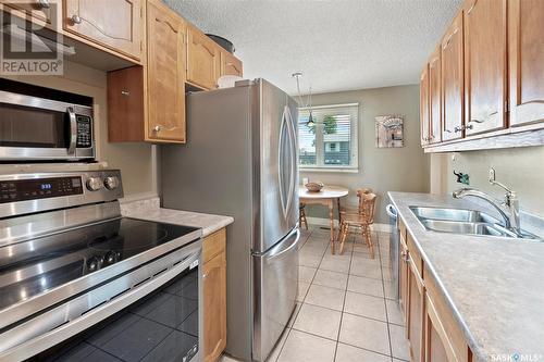 229 Langevin Crescent, Saskatoon, SK - Indoor Photo Showing Kitchen With Stainless Steel Kitchen With Double Sink