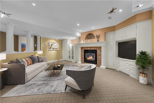 Basement family room, Virtually Staged - 190 Annabelle Street, Hamilton, ON - Indoor Photo Showing Living Room With Fireplace