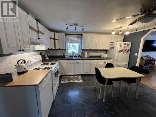 5307 43 Street, Fort Nelson, BC - Indoor Photo Showing Kitchen With Double Sink