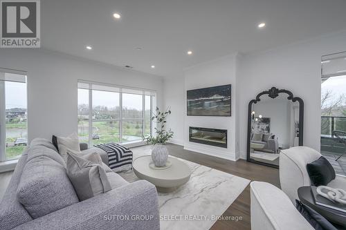 212 - 460 Callaway Road, London, ON - Indoor Photo Showing Living Room With Fireplace