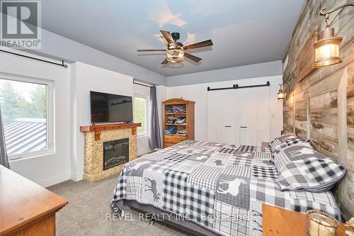 9695 Grassy Brook Road, Niagara Falls, ON - Indoor Photo Showing Bedroom With Fireplace