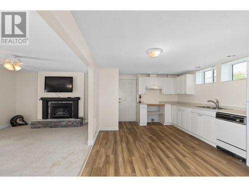 2169 Peters Road, West Kelowna, BC - Indoor Photo Showing Kitchen With Fireplace With Double Sink