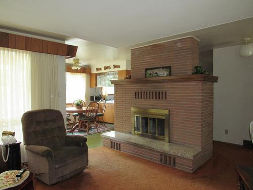 2629 9Th Avenue, Castlegar, BC - Indoor Photo Showing Living Room With Fireplace