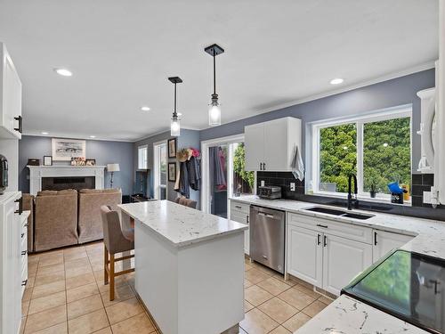 1032 Fleetwood Crt, Kamloops, BC - Indoor Photo Showing Kitchen With Fireplace With Double Sink