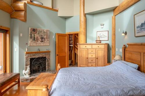 3700 Partridge Road, Naramata, BC - Indoor Photo Showing Bedroom With Fireplace