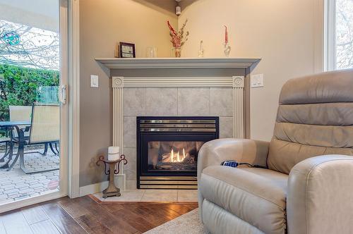 102-2300 Benvoulin Road, Kelowna, BC - Indoor Photo Showing Living Room With Fireplace