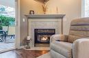 102-2300 Benvoulin Road, Kelowna, BC  - Indoor Photo Showing Living Room With Fireplace 