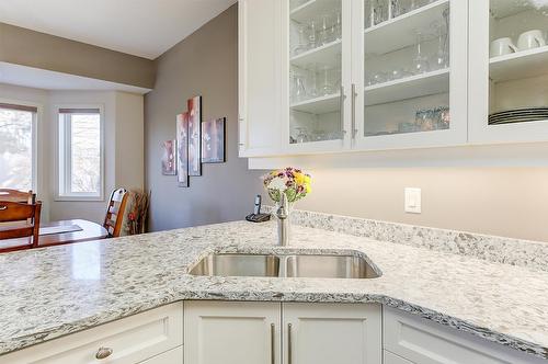 102-2300 Benvoulin Road, Kelowna, BC - Indoor Photo Showing Kitchen With Double Sink With Upgraded Kitchen