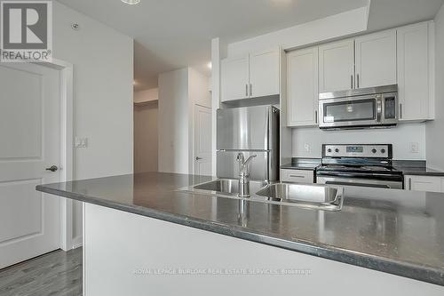 232 - 35 Southshore Crescent, Hamilton (Stoney Creek), ON - Indoor Photo Showing Kitchen With Stainless Steel Kitchen With Double Sink