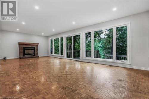 sunroom overlooking the water! - 453 2Nd Avenue W, Owen Sound, ON - Indoor Photo Showing Living Room With Fireplace