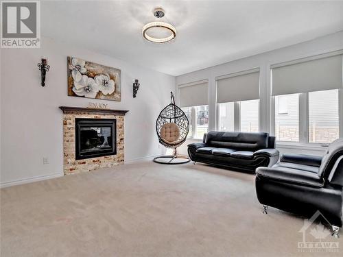 107 Dun Skipper Drive, Ottawa, ON - Indoor Photo Showing Living Room With Fireplace