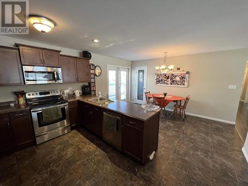 5641 Birch Drive, Fort Nelson, BC - Indoor Photo Showing Kitchen With Double Sink