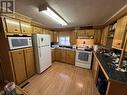 14 4603 S 50 Avenue, Fort Nelson, BC  - Indoor Photo Showing Kitchen 