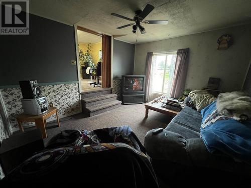 14 4603 S 50 Avenue, Fort Nelson, BC - Indoor Photo Showing Living Room With Fireplace