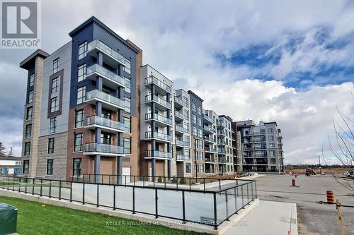 418 - 600 North Service Road, Hamilton (Lakeshore), ON - Outdoor With Balcony With Facade