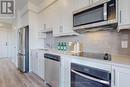 418 - 600 North Service Road, Hamilton (Lakeshore), ON  - Indoor Photo Showing Kitchen With Stainless Steel Kitchen 