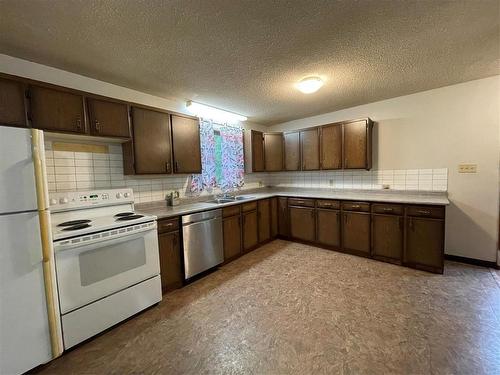 63 1St Street E, Swan River, MB - Indoor Photo Showing Kitchen With Double Sink