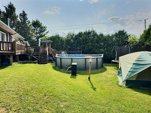 Backyard - 25 Carré Roberge, Saint-Bruno-De-Guigues, QC - Outdoor With Above Ground Pool With Backyard