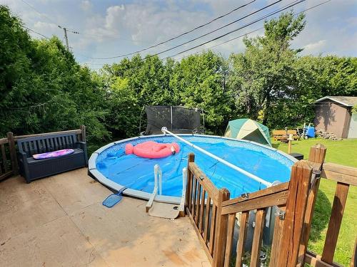 Pool - 25 Carré Roberge, Saint-Bruno-De-Guigues, QC - Outdoor With Above Ground Pool With Backyard