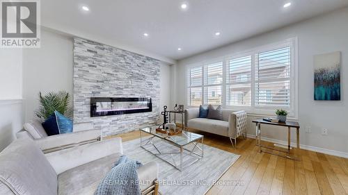 121 Longboat Run Road W, Brantford, ON - Indoor Photo Showing Living Room With Fireplace