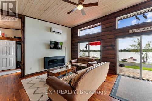 1083 Riverside Drive, Parry Sound Remote Area, ON - Indoor Photo Showing Living Room With Fireplace