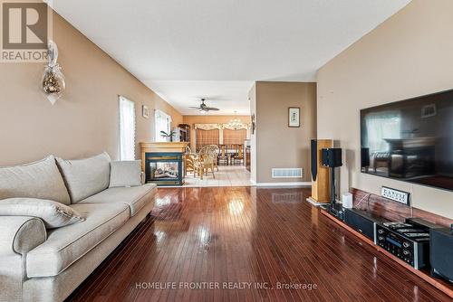 1906 Webster Boulevard W, Innisfil, ON - Indoor Photo Showing Living Room With Fireplace