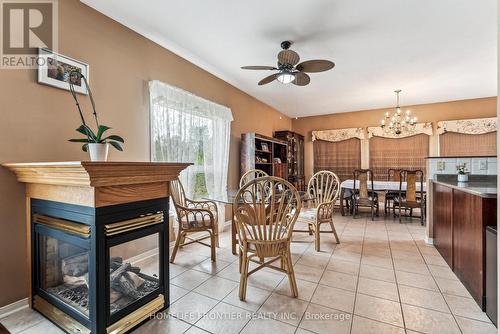 1906 Webster Boulevard W, Innisfil, ON - Indoor Photo Showing Dining Room With Fireplace