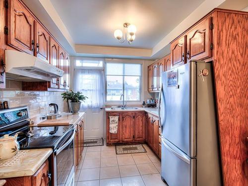 Kitchen - 813  - 815 Tsse Albert, Laval (Chomedey), QC - Indoor Photo Showing Kitchen With Double Sink