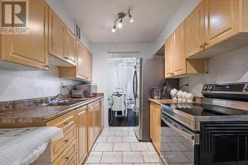 201 - 180 Markham Road, Toronto (Scarborough Village), ON - Indoor Photo Showing Kitchen With Double Sink