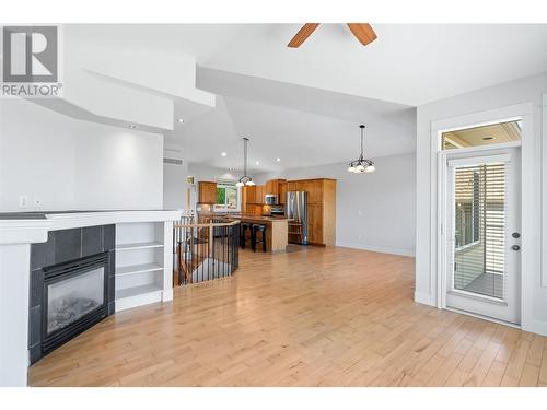 4983 Windsong Crescent, Kelowna, BC - Indoor Photo Showing Other Room With Fireplace