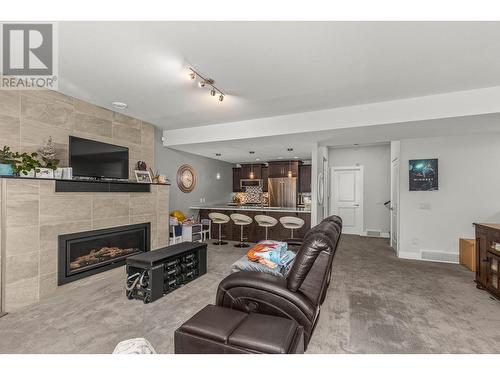 579 Selkirk Court, Kelowna, BC - Indoor Photo Showing Living Room With Fireplace