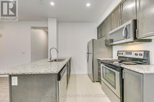 608 - 2490 Old Bronte Road, Oakville (Palermo West), ON - Indoor Photo Showing Kitchen With Double Sink With Upgraded Kitchen