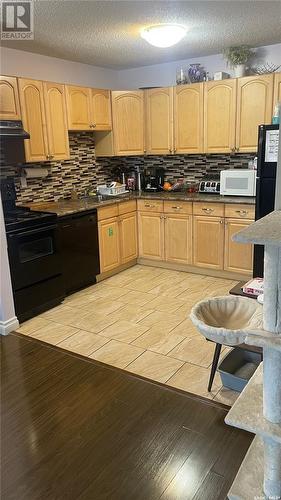 405 522 X Avenue S, Saskatoon, SK - Indoor Photo Showing Kitchen With Double Sink