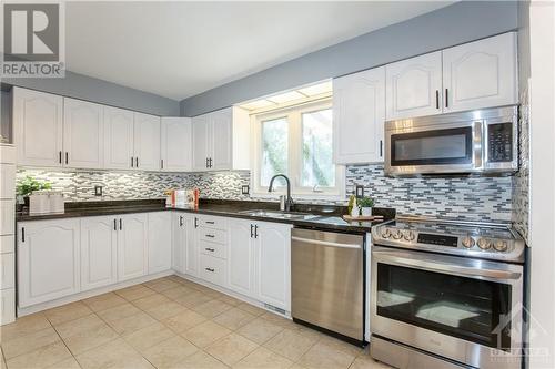 Kitchen with Granite Counter-top, Backsplash & SS Appliances - 240 Equestrian Drive, Ottawa, ON - Indoor Photo Showing Kitchen With Upgraded Kitchen