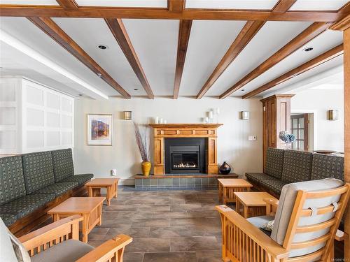 308-5625 Edgewater Lane, Nanaimo, BC - Indoor Photo Showing Living Room With Fireplace