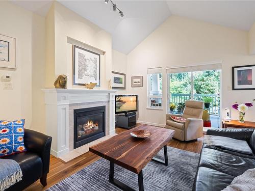 308-5625 Edgewater Lane, Nanaimo, BC - Indoor Photo Showing Living Room With Fireplace