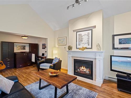 308-5625 Edgewater Lane, Nanaimo, BC - Indoor Photo Showing Living Room With Fireplace