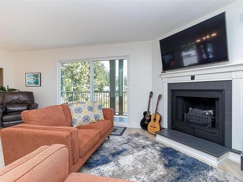 201-1991 Kaltasin Rd, Sooke, BC - Indoor Photo Showing Living Room With Fireplace