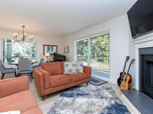 201-1991 Kaltasin Rd, Sooke, BC - Indoor Photo Showing Living Room With Fireplace