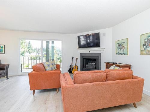 201-1991 Kaltasin Rd, Sooke, BC - Indoor Photo Showing Living Room With Fireplace