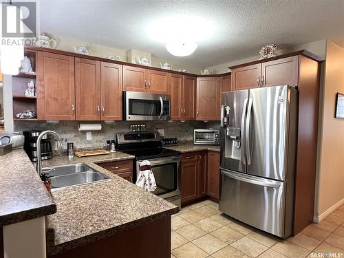 11 Fairway Court, Meadow Lake, SK - Indoor Photo Showing Kitchen With Stainless Steel Kitchen With Double Sink