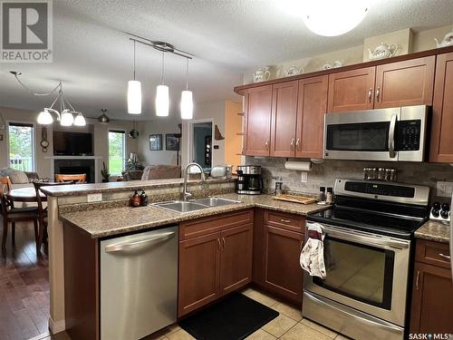 11 Fairway Court, Meadow Lake, SK - Indoor Photo Showing Kitchen With Stainless Steel Kitchen With Double Sink